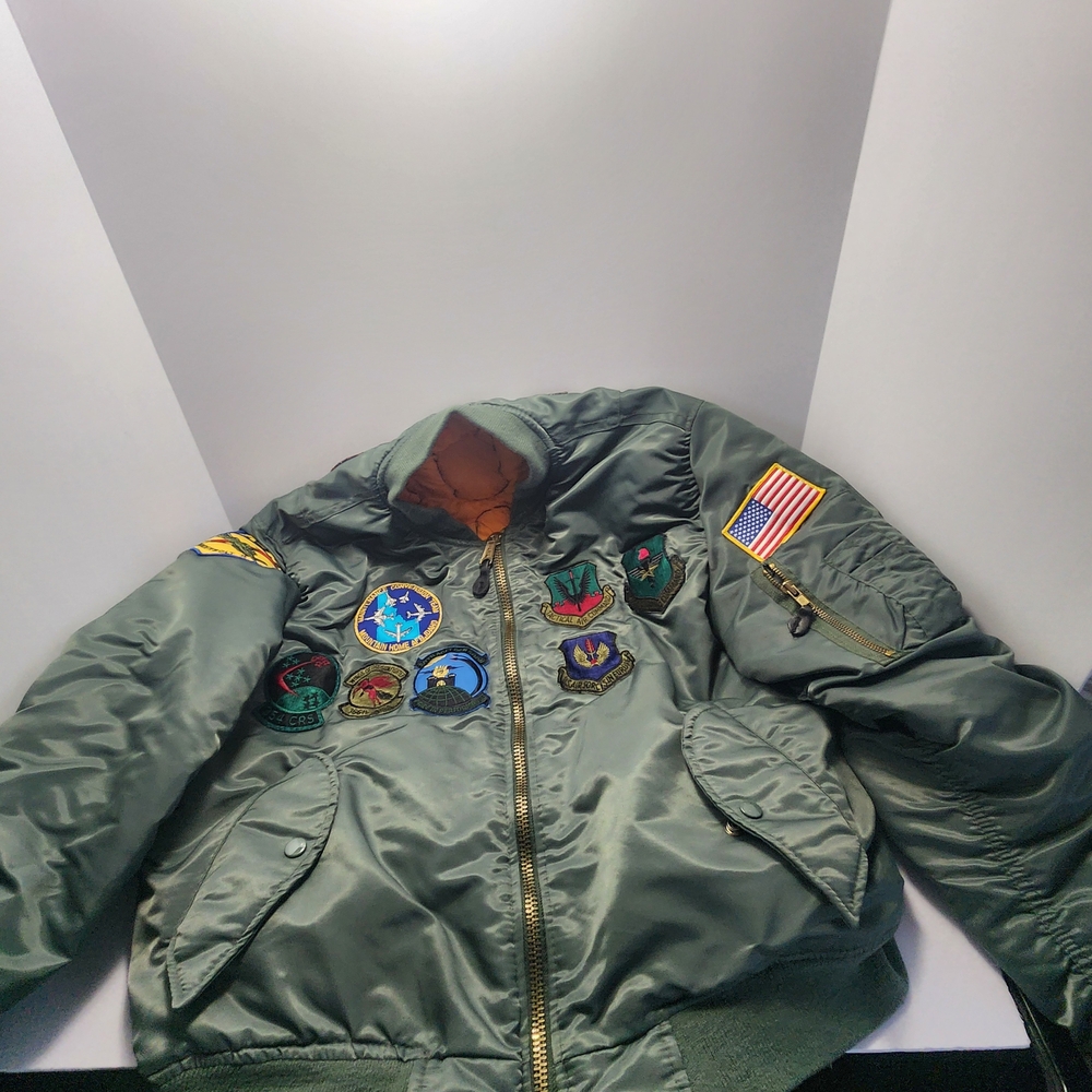 MA-1 style green nylon flight jacket with various Bomber Jacket with Patches